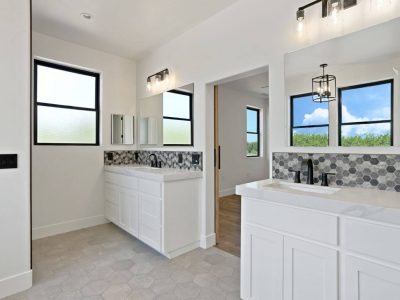bathroom with white walls and cabinets